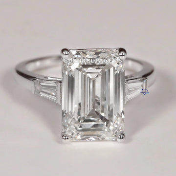Best selling solitaire diamond ring in 14 kt white gold with vvs clarity diamonds in emerald and tapered baguette Gurukrupa-Gems