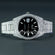 Make a bold statement in hip-hop fashion with fully iced-out moissanite diamond watch, showcasing a sleek black dial