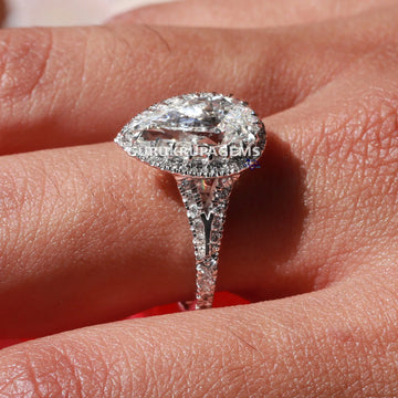 Style with elegance with this beautiful pear cut engagement ring crafted from lab grown diamonds in 14 kt white gold Gurukrupa-Gems