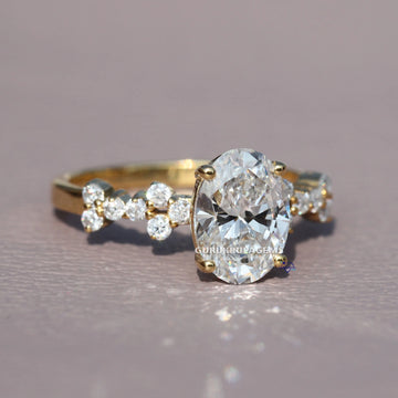 Stylishly crafted this unique oval and round cut diamond ring in 14 kt yellow gold lab grown diamonds Gurukrupa-Gems