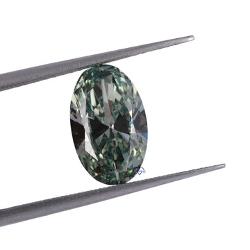 Discover the captivating brilliance of our lab-created diamond, featuring a stunning oval cut and vivid green color, all with VVS clarity.-Gurukrupa-Gems