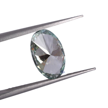 Discover the captivating brilliance of our lab-created diamond, featuring a stunning oval cut and vivid green color, all with VVS clarity.-Gurukrupa-Gems